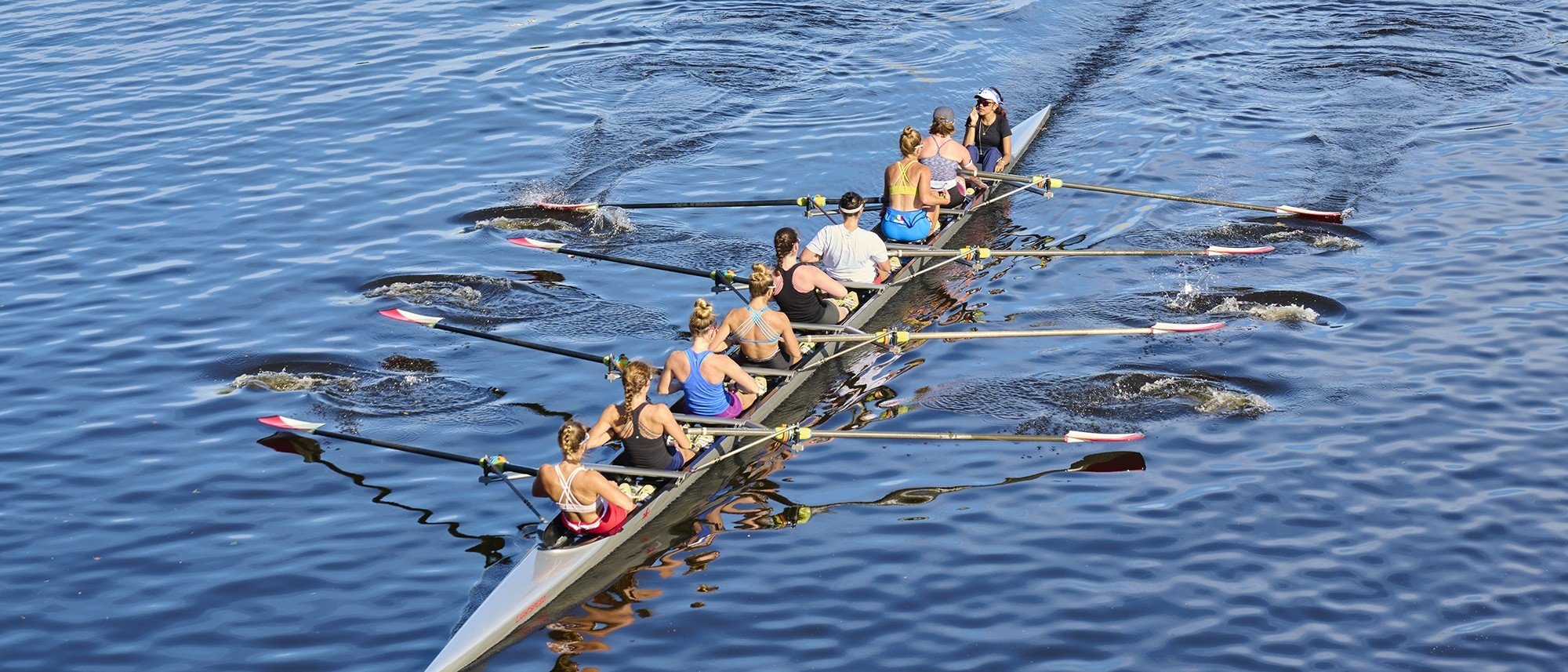 People rowing on a lake