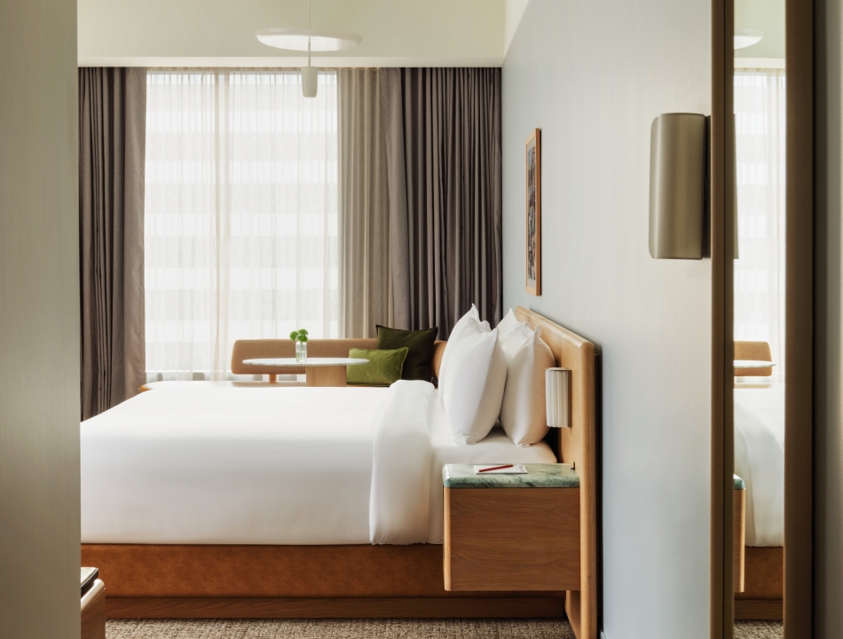 Guest room at The Atlas Hotel in Allston, Boston, which features a streamlined design with refined finishes.