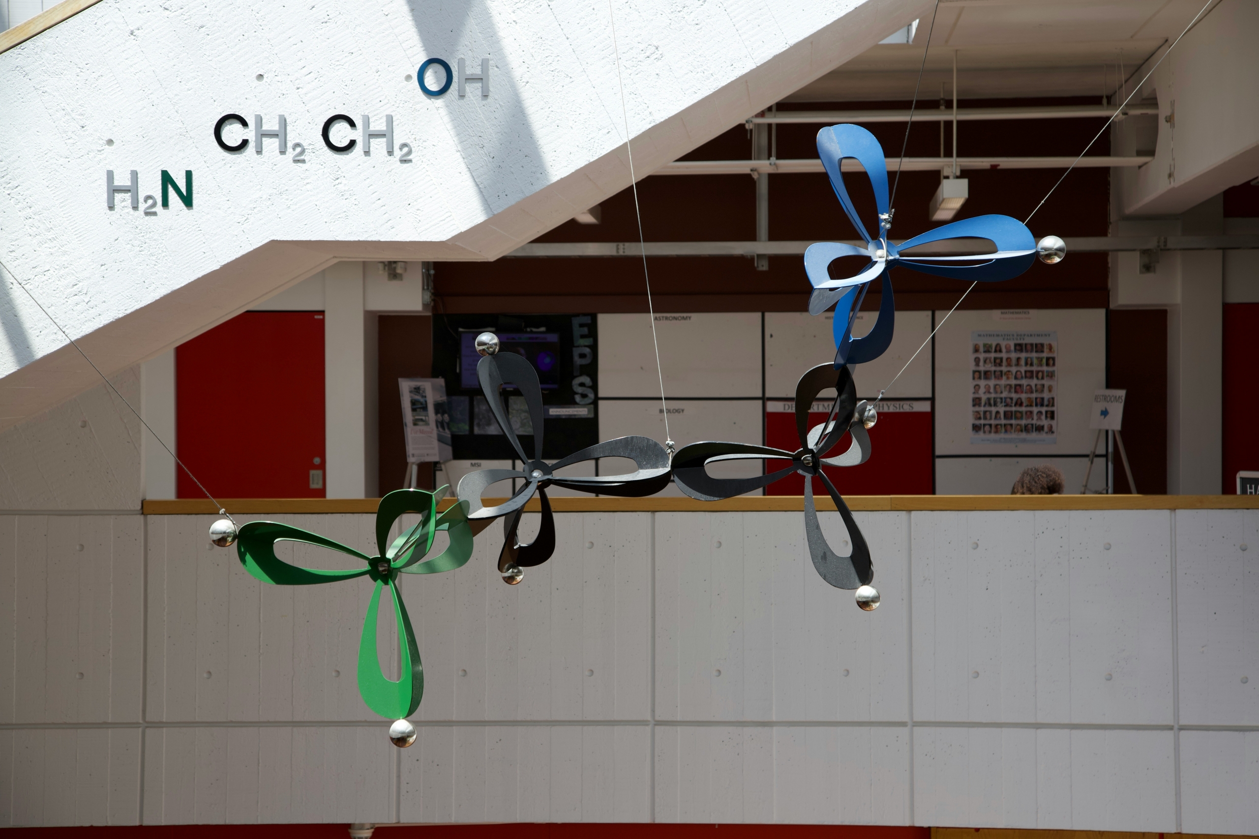 A sculpture hanging from a ceiling