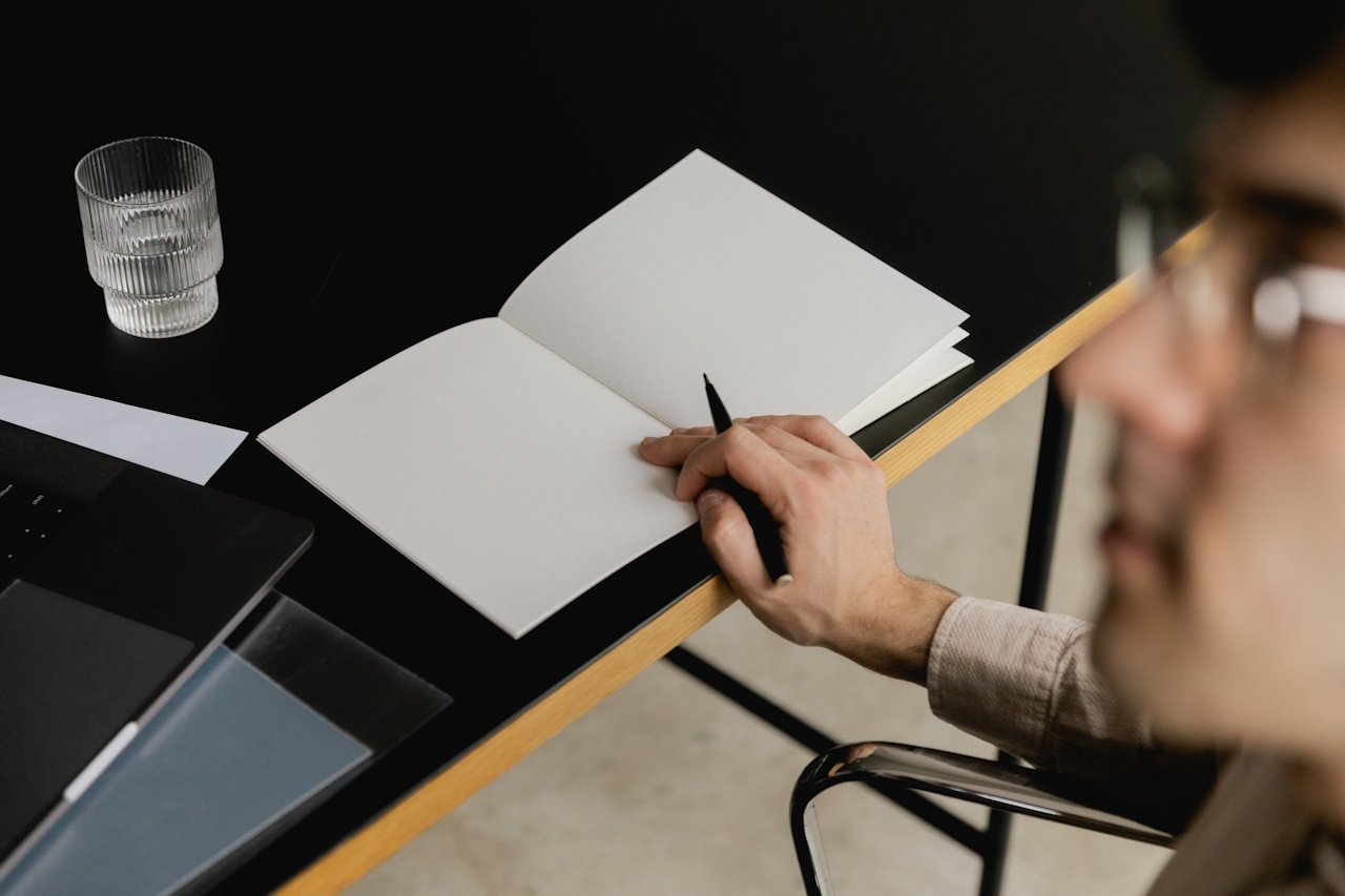 Man about to take notes at The Atlas Hotel Compass Room A