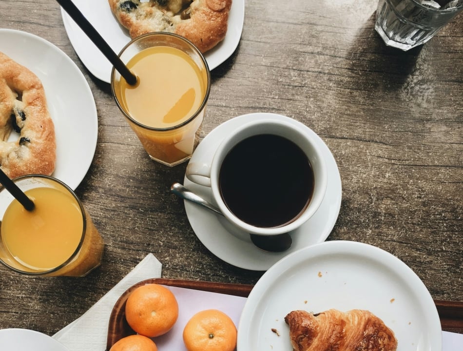 Breakfast coffee orange juice and pastries