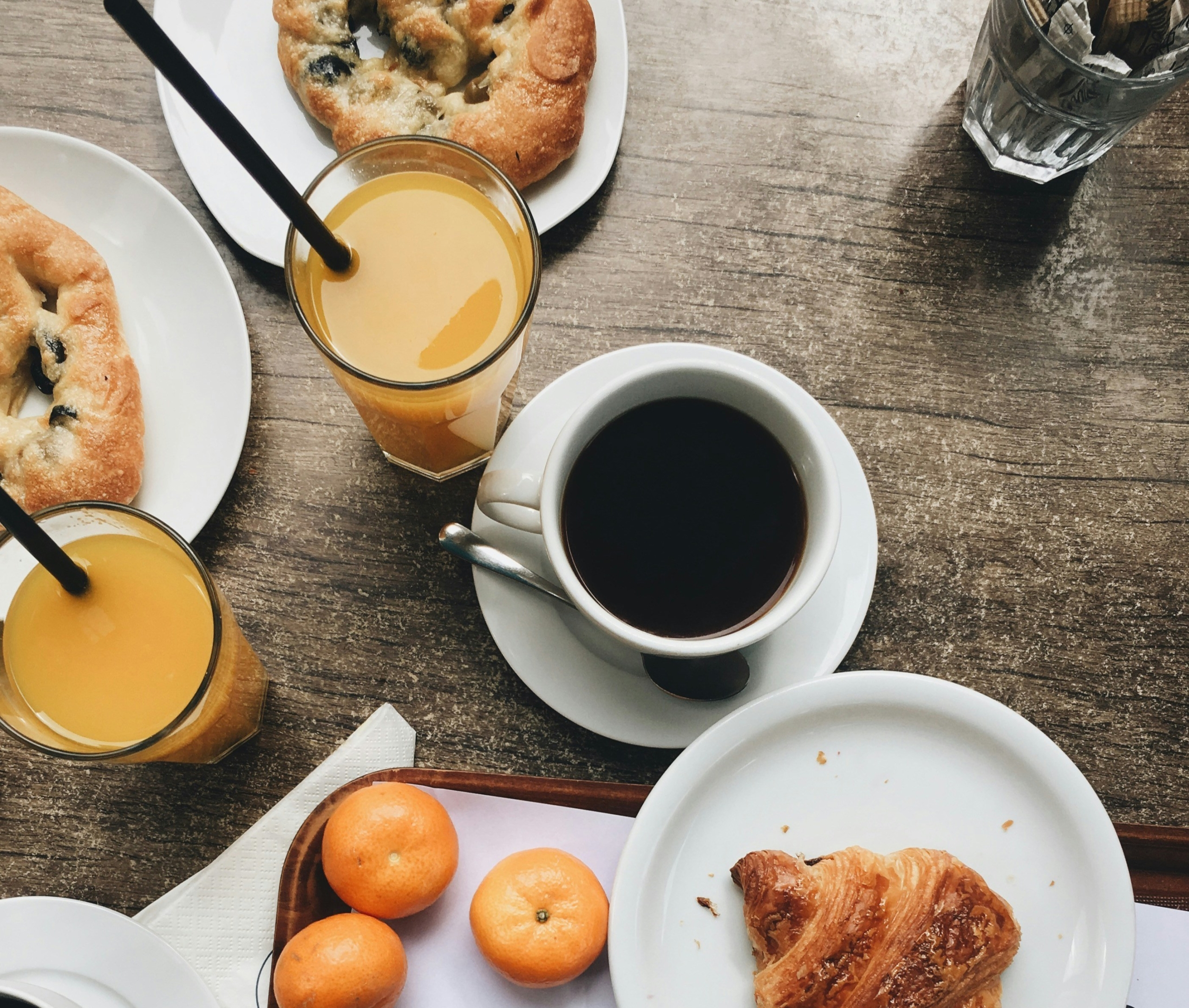 Breakfast coffee orange juice and pastries